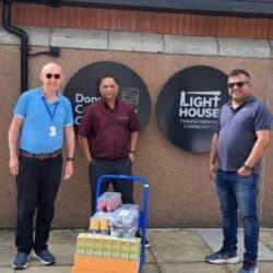 GCA representatives delivering support to a local community organisation